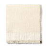 Pleddet Weaver Throw fra Ferm Living i fargen Off-white.