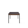 Bord Co Table Terra 100x240 cm fra Audo Copenhagen med kullfarget bordplate i laminat med sorte ben og detaljer i mørk eik.