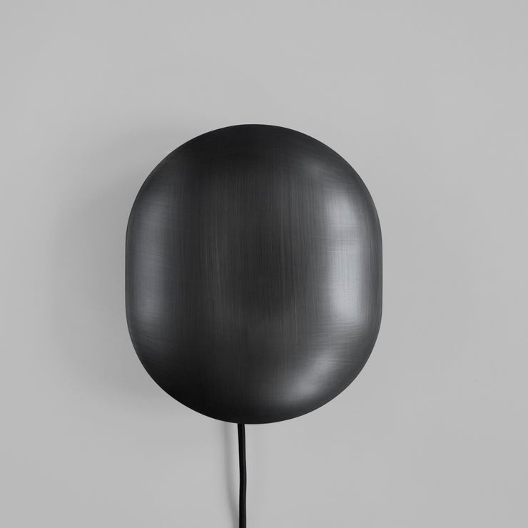 Vegglampen Clam i varianten Bronze.