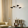 Den stemningsfulle taklampen Bonnet Chandelier fra &Tradition er designet av Space Copenhagen, som er kjent for å skape vakre møbler, lamper og tilbehør som kombinerer diskré luksus med elegant estetikk og funksjonalitet.