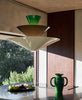 Taklampene Gio LN14 og LN15 fra &tradition er designet av italienske Luca Nichetto og er en hyllest til arkitekten Gio Ponti sin ikoniske Murano-lysekroner i farget glass. Lampene Gio LN14 og LN15 er noe mer geometriske i tolkningen, men har også en veldig vakker silhuett – og ikke minst – et fint fargespill. Taklampe Gio LN15 fra &tradition i fargen Signal Green, Deep Blue & Ecru White ((grønn, blå og kremfarget). Når lampen er tent oppleves blåfargen nesten mer brun enn blå. Overraskende og fint!