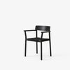 Spisestolen Betty Armchair TK9 fra andTradition i svartlakkert ask med flettet svart sete.