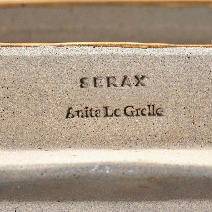 Vegglampe James fra Serax i okergul glasert keramikk