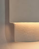 Den lys beige strukturerte overflaten kommer ekstra godt frem når lampen er tent. 