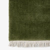Teppet The Moor Rug fra andTradition i fargen Green Pine, med frynser