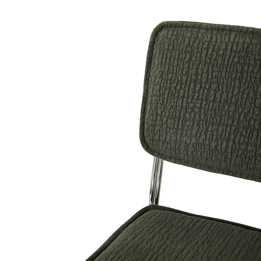 Spisestuestolen Endless Dining Chair fra HK Living med understell i forkrommet stål og polstret sete og rygg i det grønne tekstilet Edge Wild Olive