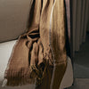 Pleddet Weaver Throw fra Ferm Living i fargen Sugar Kelp.