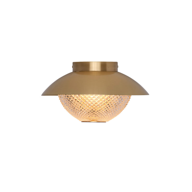 Lampen Grace i messing.