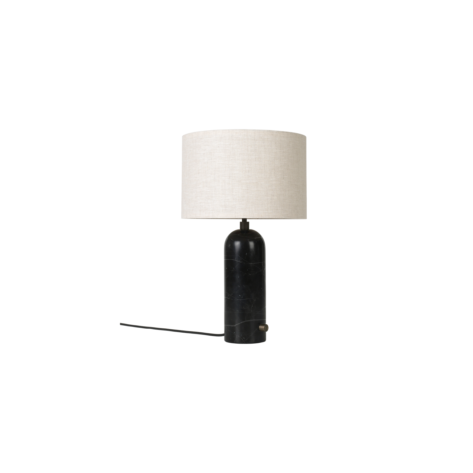 Den nye bordlampen Gravity er designet av Space Copenhagen for Gubi. Lampen har en tung sylinderformet base, og en lett og luftig skjerm som gir et mykt og vakkert lys.
