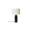 Den nye bordlampen Gravity er designet av Space Copenhagen for Gubi. Lampen har en tung sylinderformet base, og en lett og luftig skjerm som gir et mykt og vakkert lys.