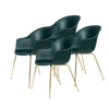Spisestolene Bat Chair fra Gubi med messingben i fargen Dark Green
