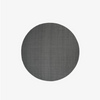 Found rug 05, stone grey. Teppet er rundt, laget i ren ull, og har en steingrå farge