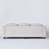 Sofaen Lola i Woven Sand sett bakfra.