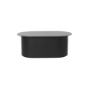 Stuebordet Podia fra ferm LIVING, er elegant og praktisk. Det ovale bordet er laget i tre, mens basen er laget av lameller.