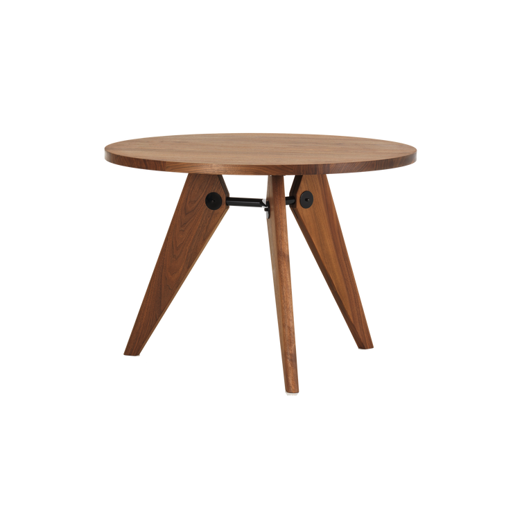 Spisebordet Guéridon Table fra Vitra, ble designet av den franske designeren og ingeniøren Jean Prouvé. Dette vakre bordet i heltre valnøtt er vakkert og arkitektonisk, med en åpen konstruksjon med tydelige industrielle referanser.